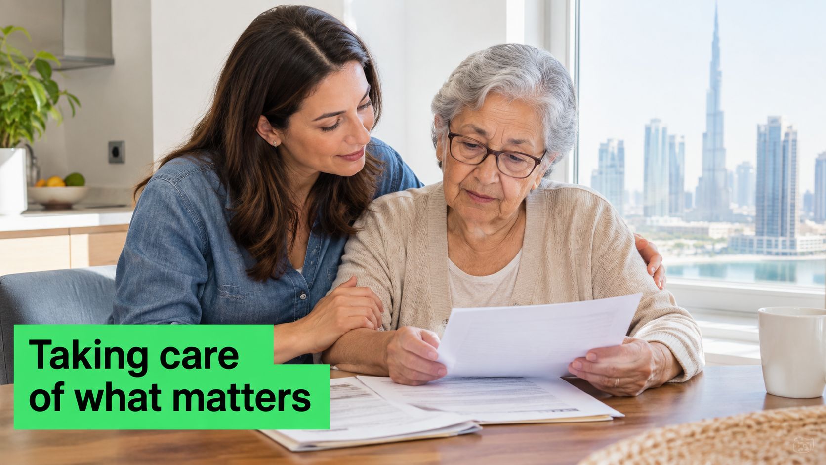 Elderly Care Services in Dubai: A Complete Family Guide 5 A caring woman sits at a table helping an elderly woman review important documents at home.